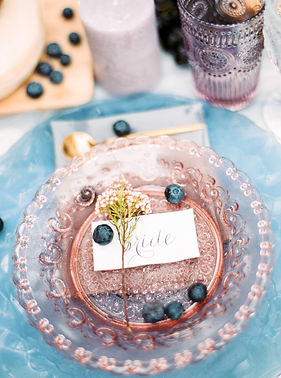 Wedding table placement decor in light tones of blush and blue