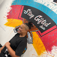 Stay Gifted mural on barbershop wall