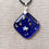 Thumbnail: Deep Blue fused glass pendant with gold flecks and white paper star inclusion.