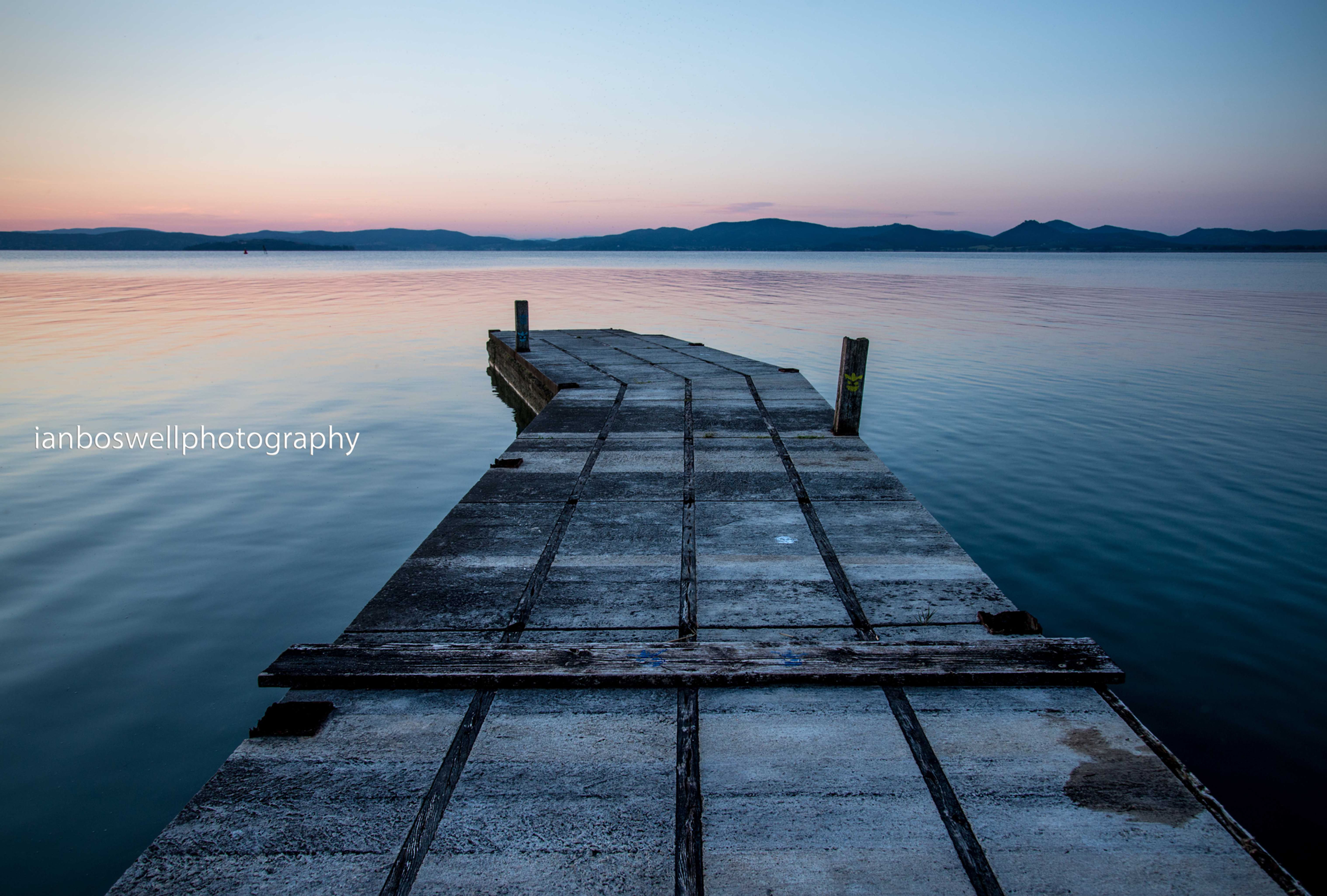 pier on trasimeno at sunrise