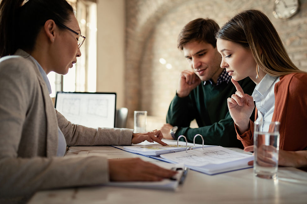 Real Estate agent meeting with clients