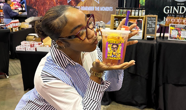 Customer kissing fathead's lemonade drink