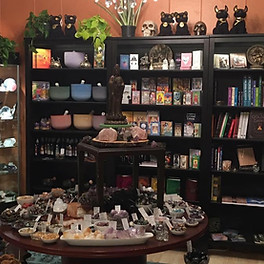The interior of Raven's Wing Co-op store. Vafrious books, tarot decks, crystals