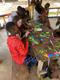 Children working on flowers for Mother's Day