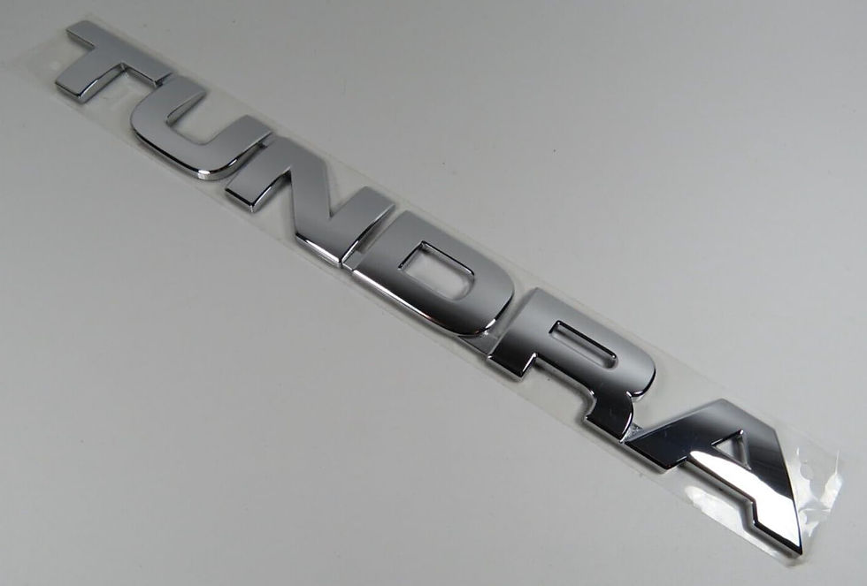 2006-2014 Toyota Tundra Silver Fender Nameplate 75471-0C040 emblem with a bright metallic finish.