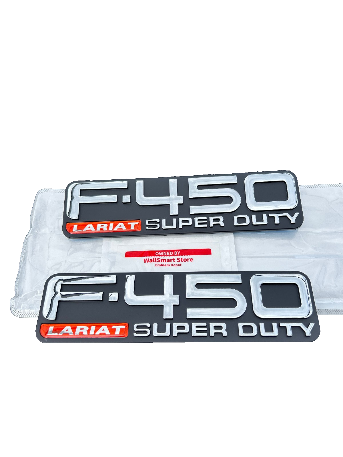 Front View of 1999-2004 Ford F-450 Lariat Super Duty Fender 5C3Z-16720-AB Nameplate Set showing both Emblems Sides