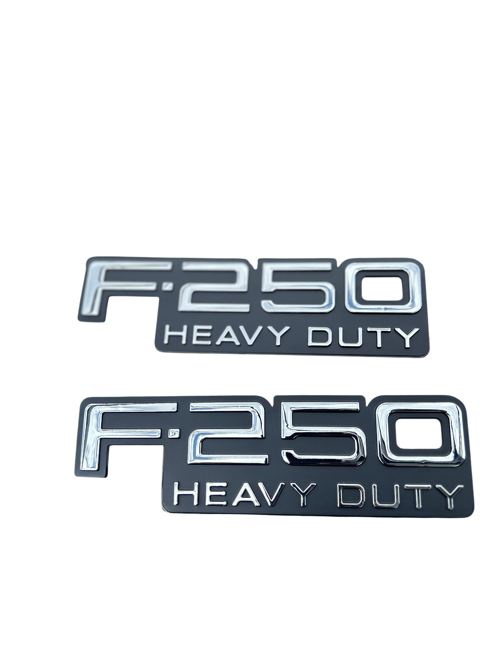 Front View Close-up of the red lettering on the 1992-1996 Ford F-250 XL fender emblem highlighting chrome finish
