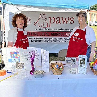 PAWS Volunteers in booth.jpg