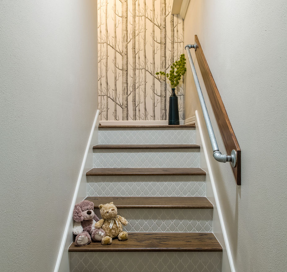 Stairs and hallway, A Conroe, TX home renovation by By Design Interiors with custom selections and home furnishings.