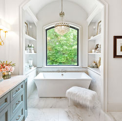 white traditional bathroom with freestanding tub