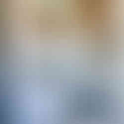 the tile is mimic in between open shelving above the laundry machines