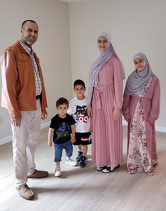 1688 - Driss and kids in new house.jpg