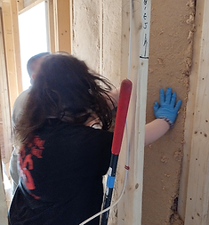 Raye puts in insulation at Wiggins.png