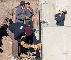 Chestnut St - Dietz Architects - volunteers sealing foundation-4.jpg