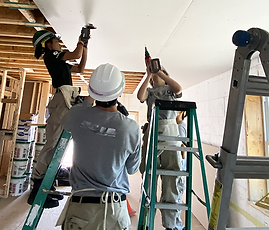 River 4 team installing drywall at Chicopee-6.png