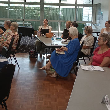 Writers attentively listening to presentation