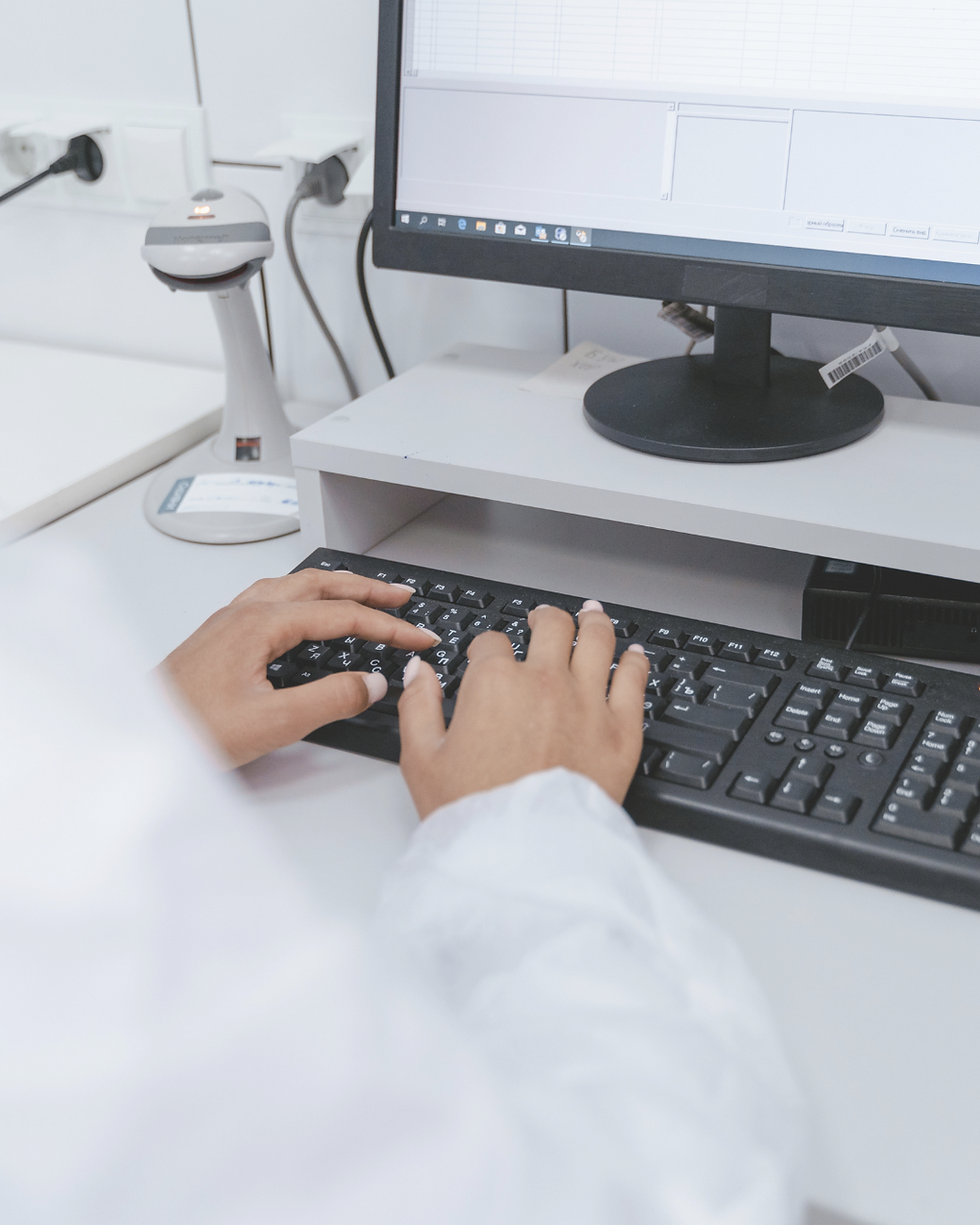 Hands typing on keyboard