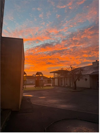 The sunrise over my school