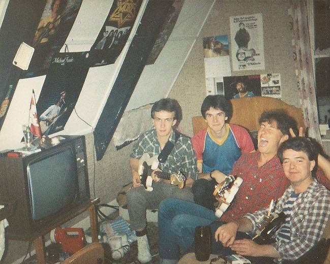 Old photo: 4 friends with guitars having fun
