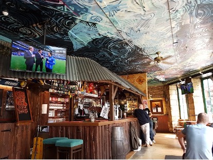 Very DIY bar with people ordering