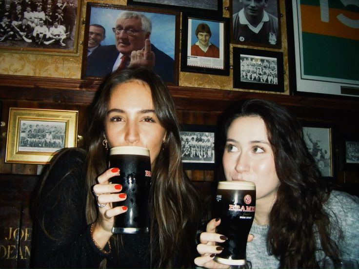 When in Ireland - two girls drinking a dark ale (Guinness I presume).