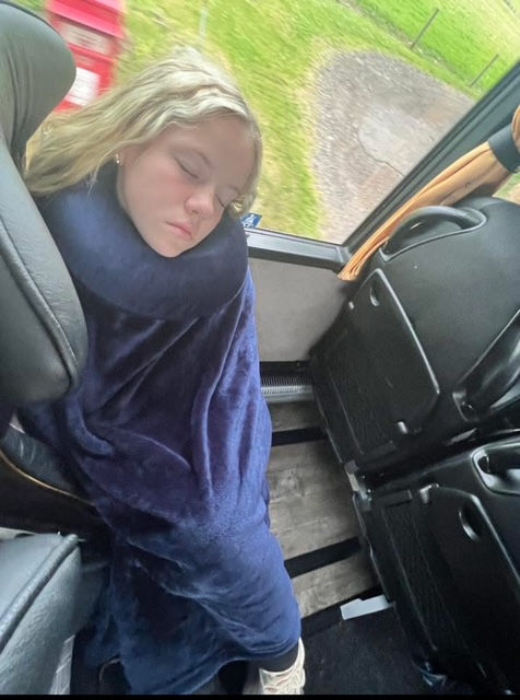 High angle view of a memory foam travel pillow on an airplane tray table