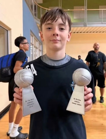 Description: Athletes competing in a high-energy one-on-one basketball challenge to test their skills and mental toughness.  