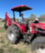 Travis Gerckens, our Farm Manager, using the newly acquired tractor.