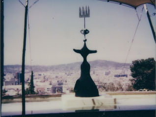 a miro sculpture against the barcelona landscape