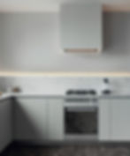 Fogão e cozinha em tons de cinza.