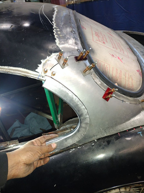 Final fitment check on the custom side window frame for 1959 Jaguar XK150 by FFR Fabrication