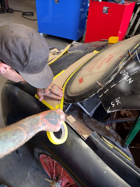 Template fabrication for the back window to trunk filler panel on the 1959 Jaguar XK150 by FFR Fabrication