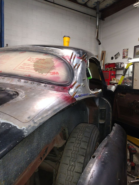 Spring clenched custom side window frame for1959 Jaguar XK150 by FFR Fabrication