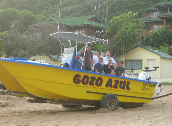 fishing boat going out on Ponto beach in Mozambique