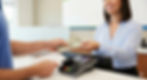 IMAGE OF CASH TRANSACTION AT A PROFESSIONAL OFFICE COUNTER