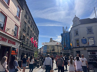 Tourists listening to a local guide in Galway