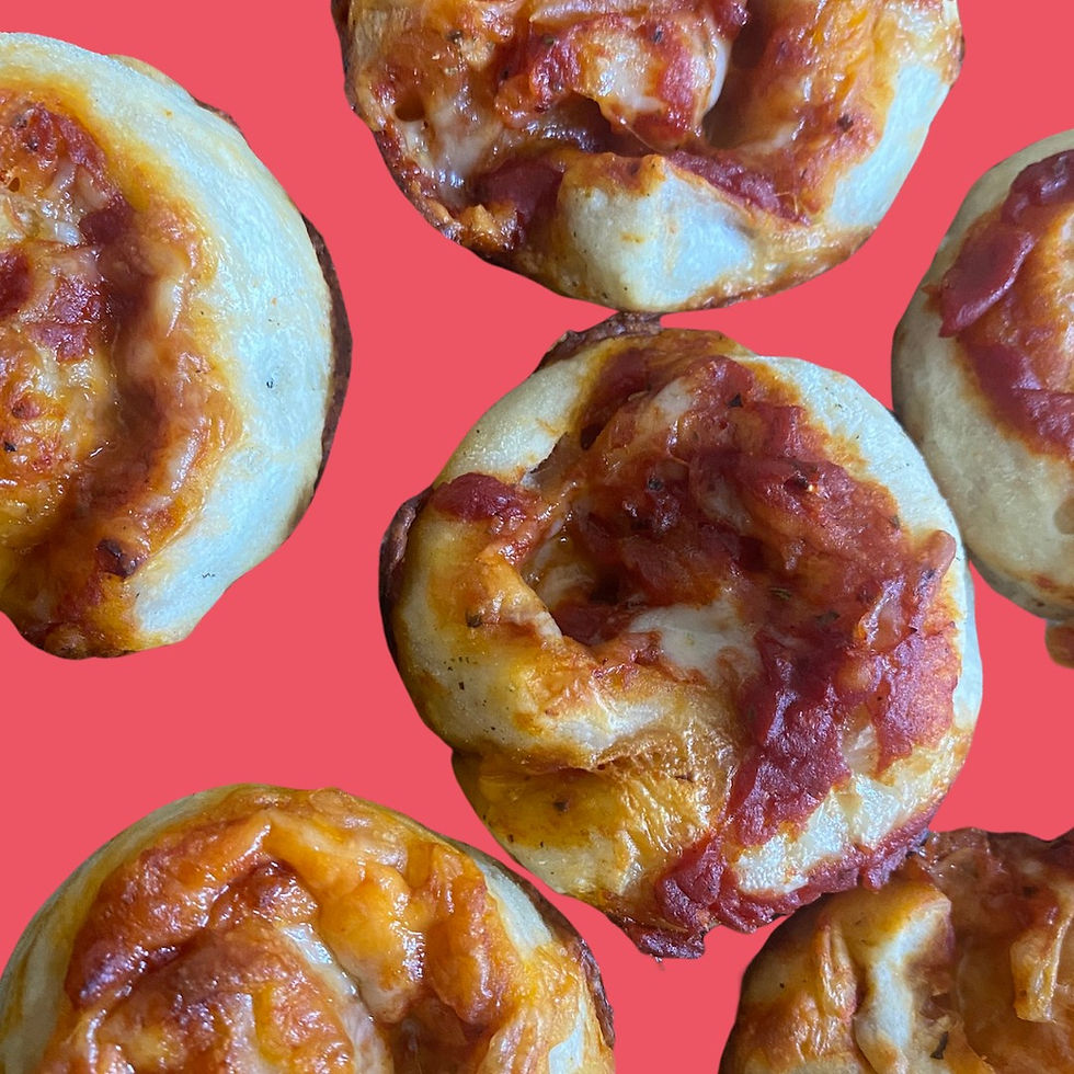 A bunch of pizza rolls covered in tomato sauce and cheese