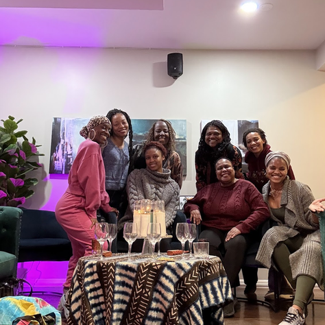 Amawi Arminta poses with a group of women who attended the Sisters' Healing Circle presented by Ora Healing XP February 2025