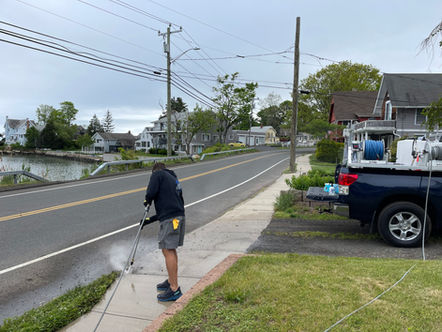 Power wash of sidewalk for instant increase in curb appeal