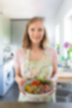 food-blogger-with-veggy-bowl-happy-woman-holding-homemade-vegetable-dish-standing-kitchen-