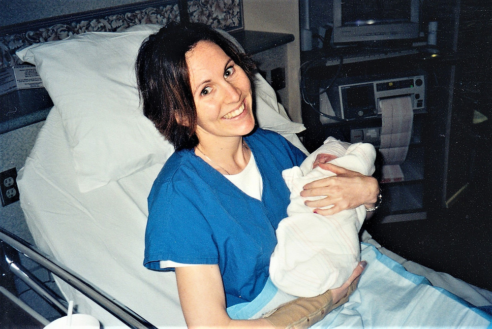 Natalie craddling Preston minutes after he was born.