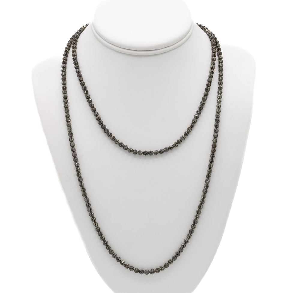 Two layered beaded necklace displayed on a white jewelry bust Ofira Jewels