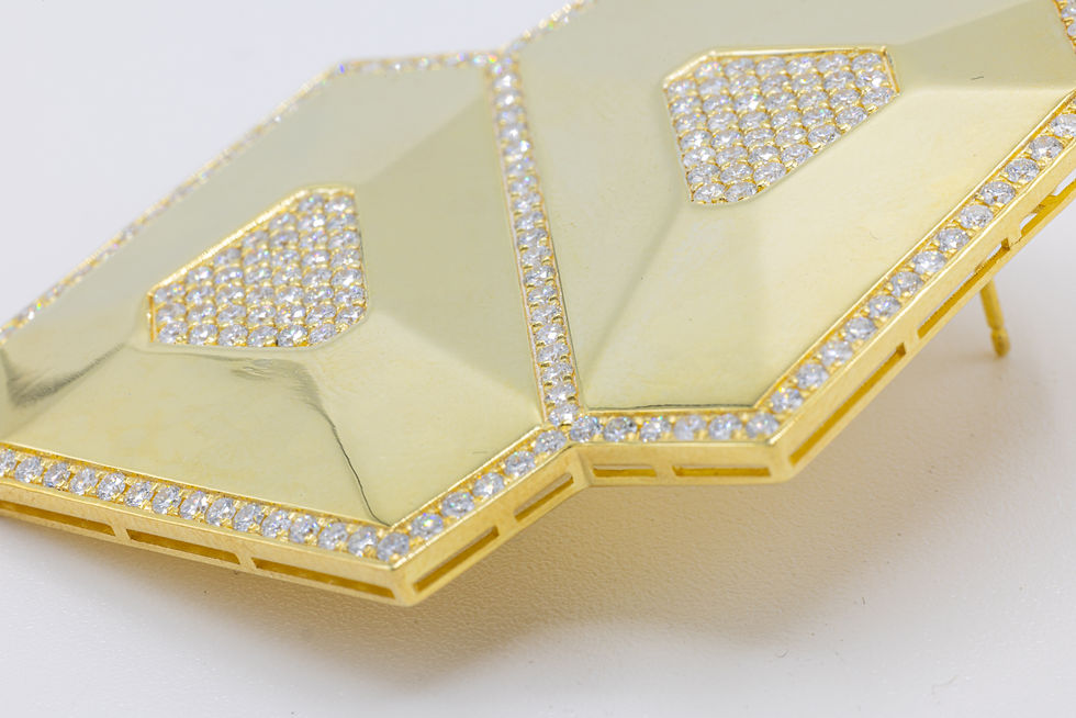 Miniature : Close-up of geometric gold jewelry with diamond accents, Ofira Jewels.