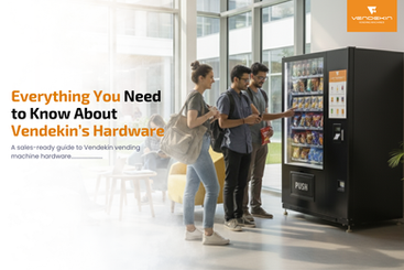 A group of people using a Vendekin smart vending machine in a bright modern space, showcasing innovative hardware design and product accessibility.