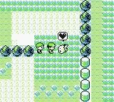 Two pixelated characters and a creature in grassy terrain. A heart symbol floats above the creature, suggesting affection or bonding.