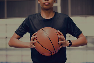 African%2520American%2520teenage%2520boy%2520holding%2520a%2520basketball%2520on%2520the%2