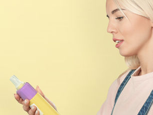 Woman checking a bottle.