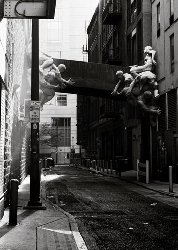 Sculptures holding a walkway bridge