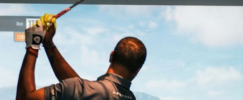man playing golf sim in crafted swing