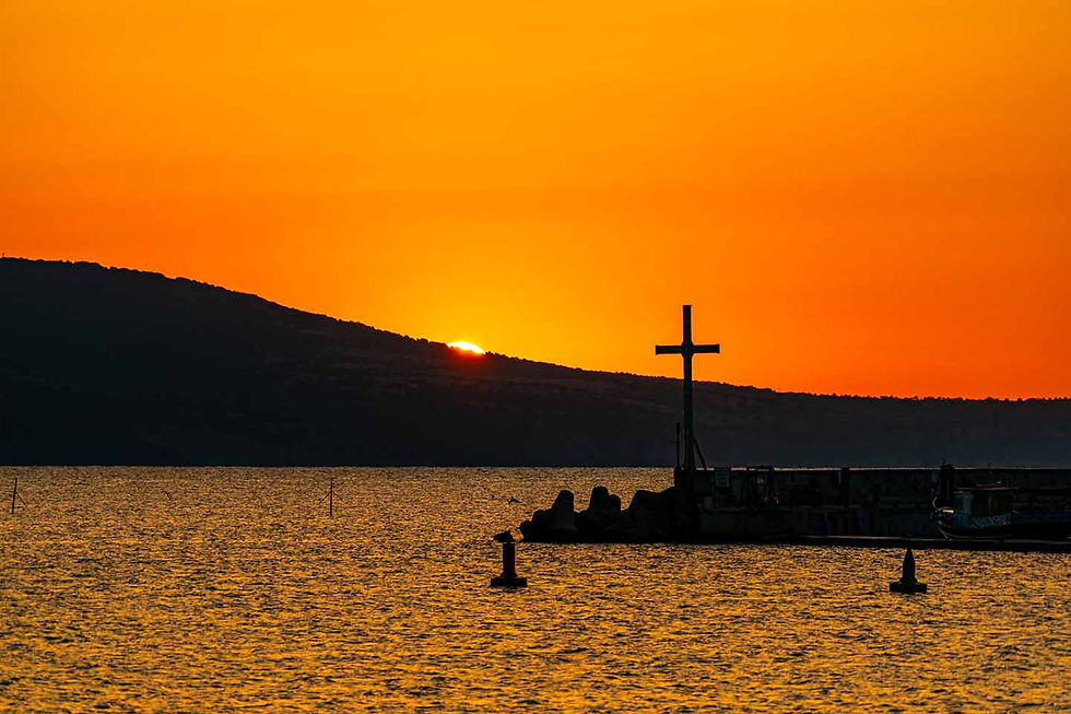 The sun is barely peeking out from behind the Balkan Mountains in Nessebar
